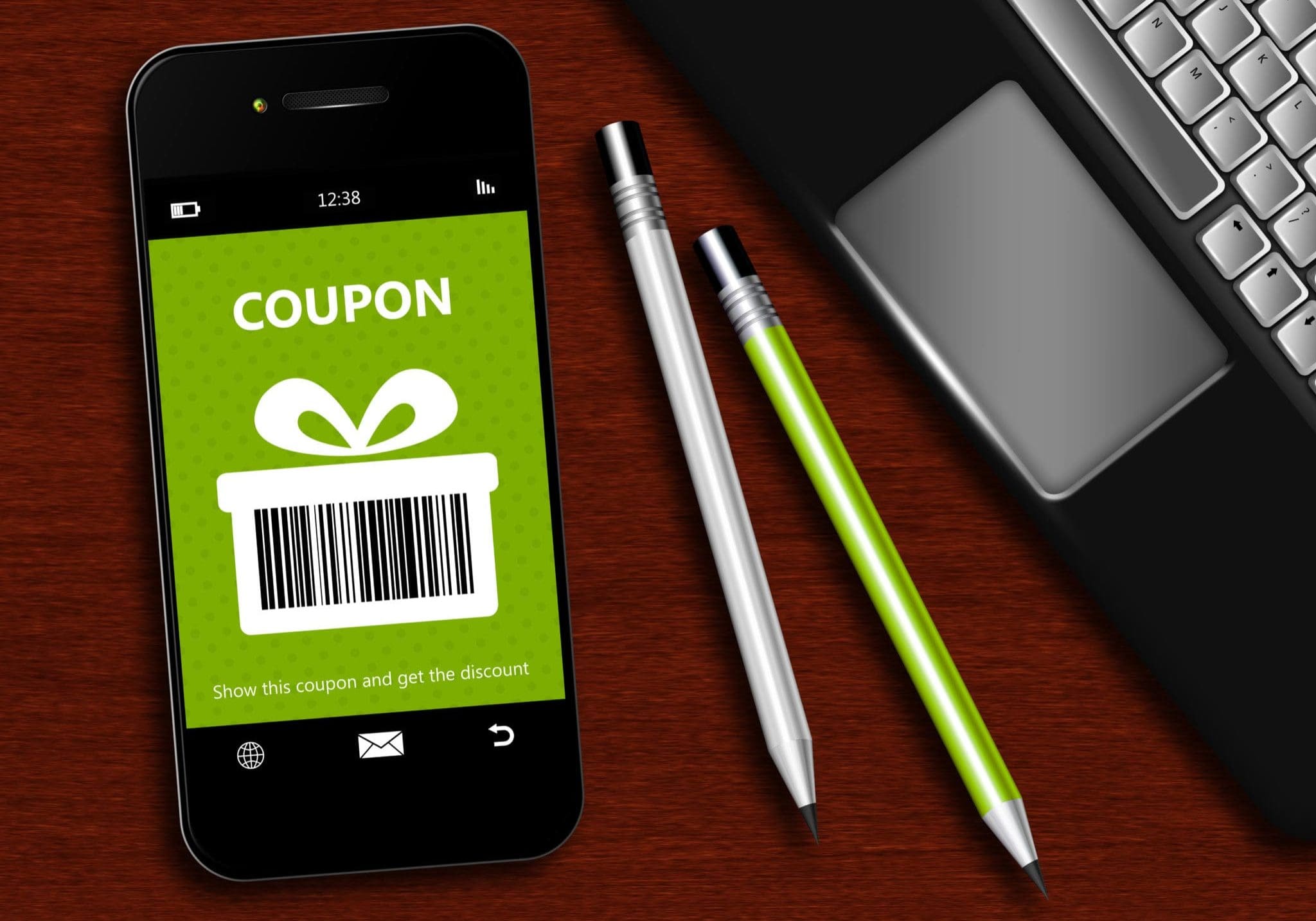 mobile phone with spring discount coupon laptop and office tools lying on desk